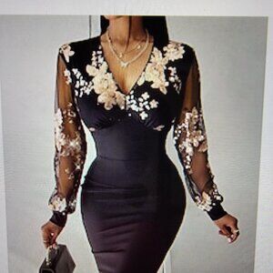 Shapely black dress with gold sequenced applics